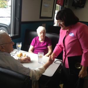 Annie speaking with voters at Suzie's diner in Hudson